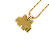 right angle view of the smiley invader pendant in gold on a white background