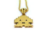 up close view of the Stoney invader pendant in gold on a white background
