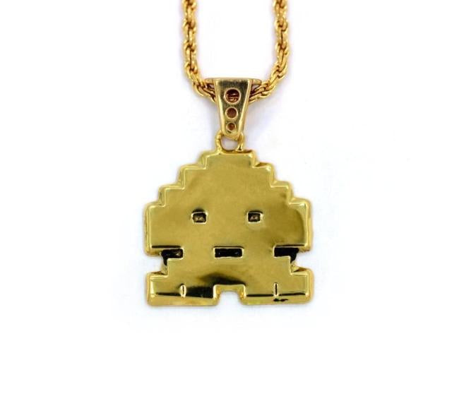 front view of the Stoney invader pendant in gold on a white background