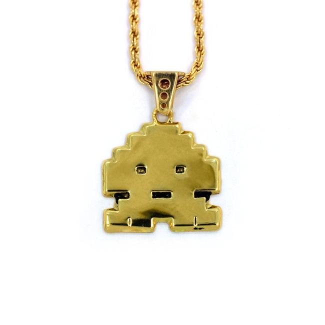 front view of the Stoney invader pendant in gold on a white background