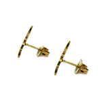 side view of the swiftwind studs in gold facing left casting a shadow