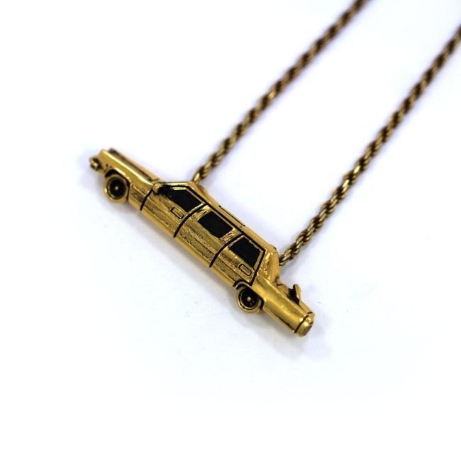 left angle of The High Life Pendant in gold form the han cholo cruising collection