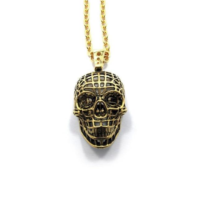 front of the Mesh Skull Pendant in gold from the han cholo skulls collection