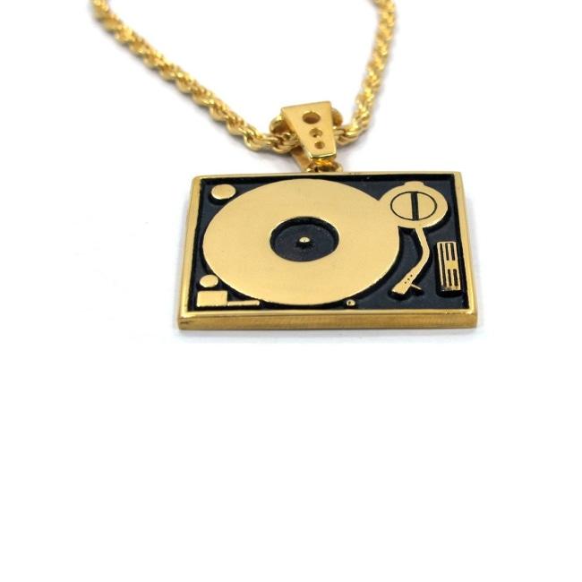 close up of the Turntable Pendant in gold from the han cholo music collection