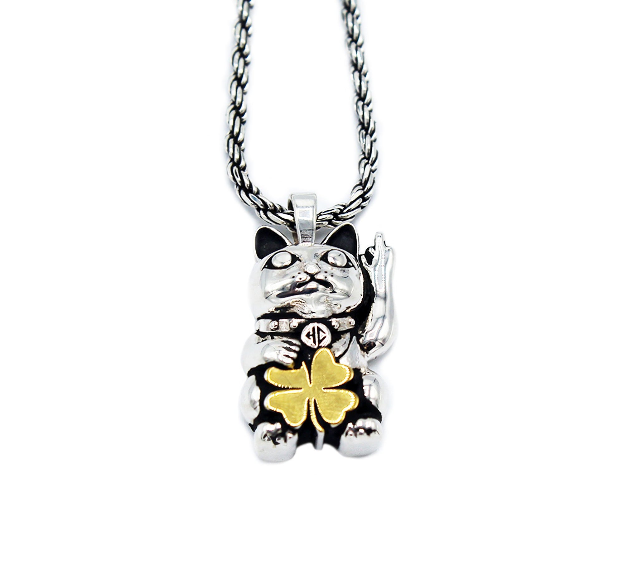 two tone unlucky cat necklace with cat having middle finger and holding gold clover