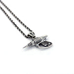 left side shot of the Zap pendant in silver on a white surface