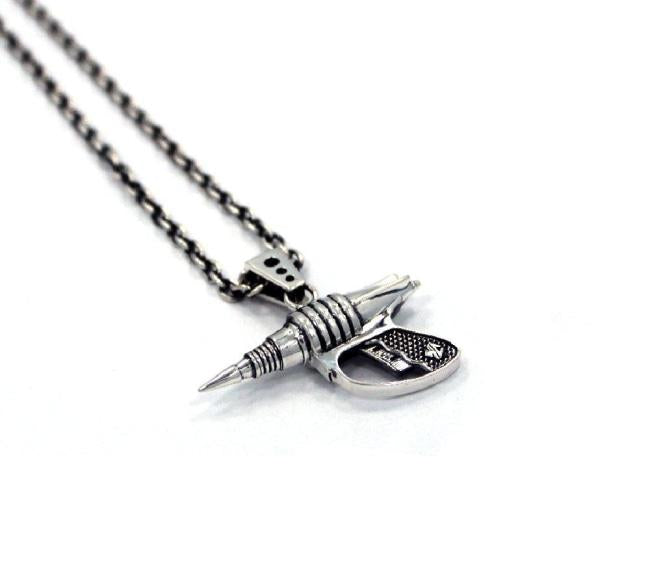 left side shot of the Zap pendant in silver on a white surface