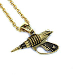 up close right side shot of the Zap pendant in gold on a white surface