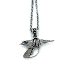 back view of the Zap pendant in silver on a white surface