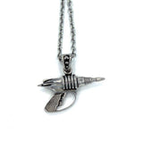 back view of the Zap pendant in silver on a white surface