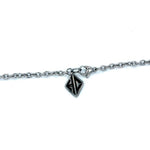 shot of the hc tag on the cable chain of the zap pendant in silver