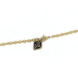 shot of the hc tag on the cable chain of the zap pendant in gold