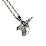 right side view of the Zap pendant in silver on a white surface