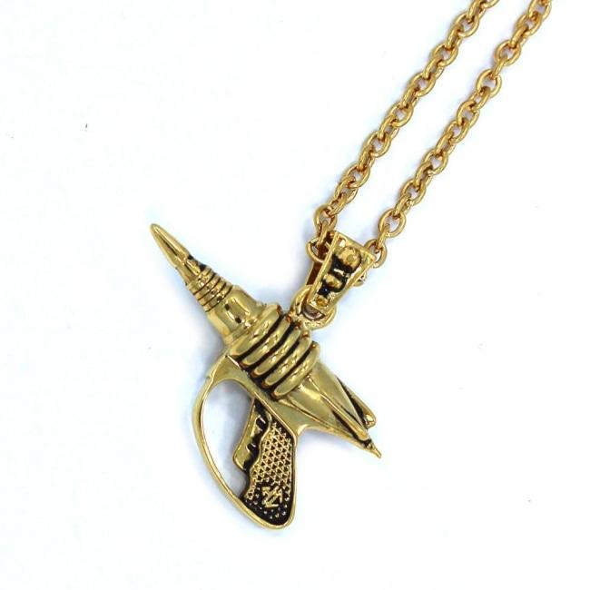 left side view of the Zap pendant in gold on a white surface