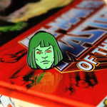 front shot of the Zombie horde He-Man enamel pin on a masters of the universe book